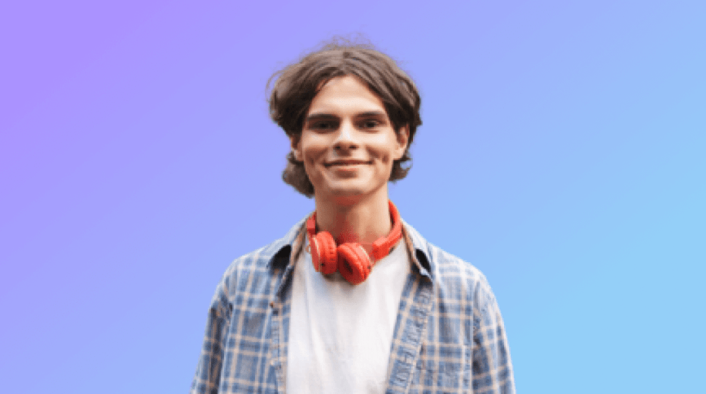 Smiling boy with red headphones standings and holding skateboard 1